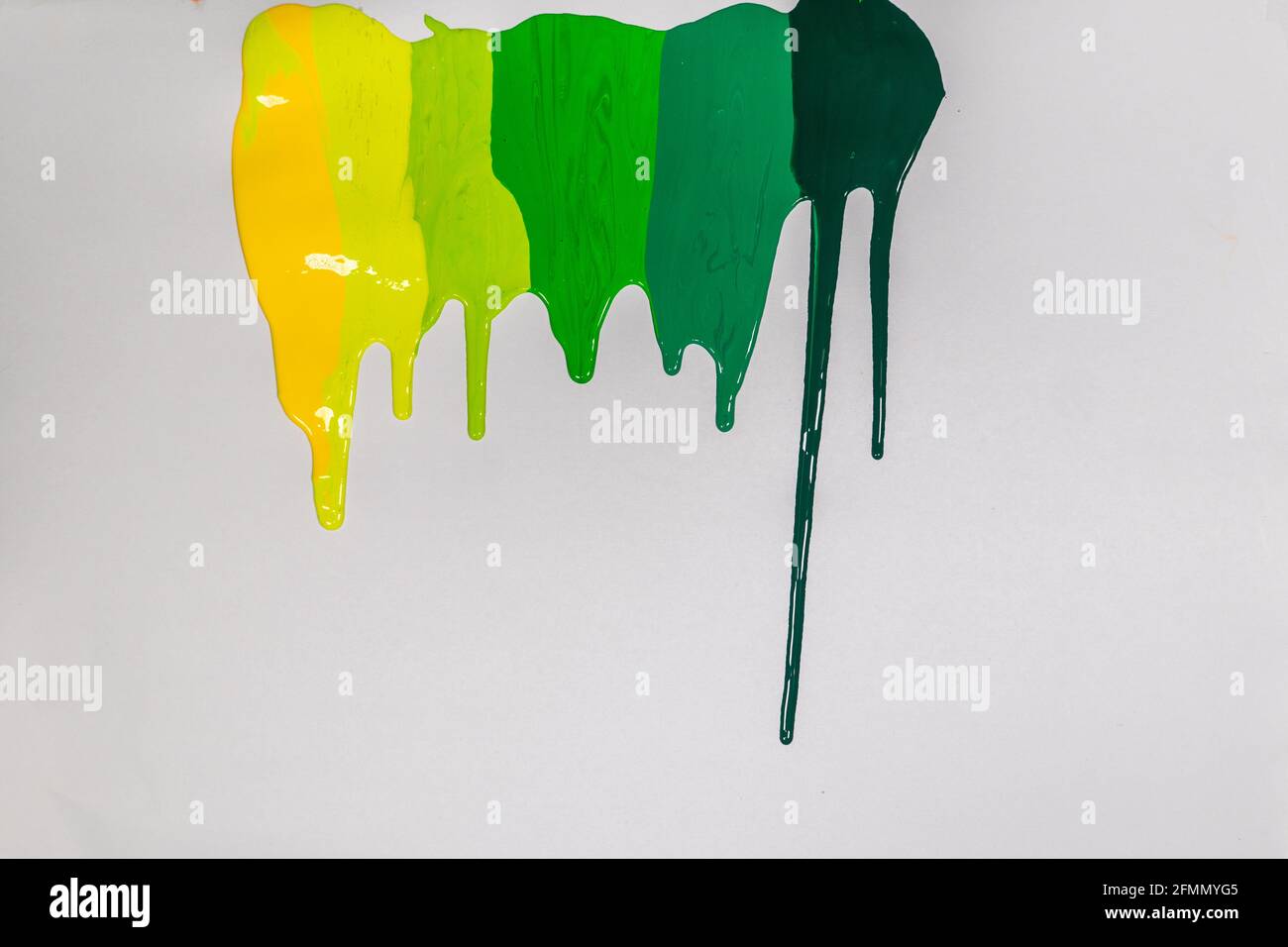 abstract art every green background. every green are shaded from light green to strong green, dripping into the white paper. Stock Photo