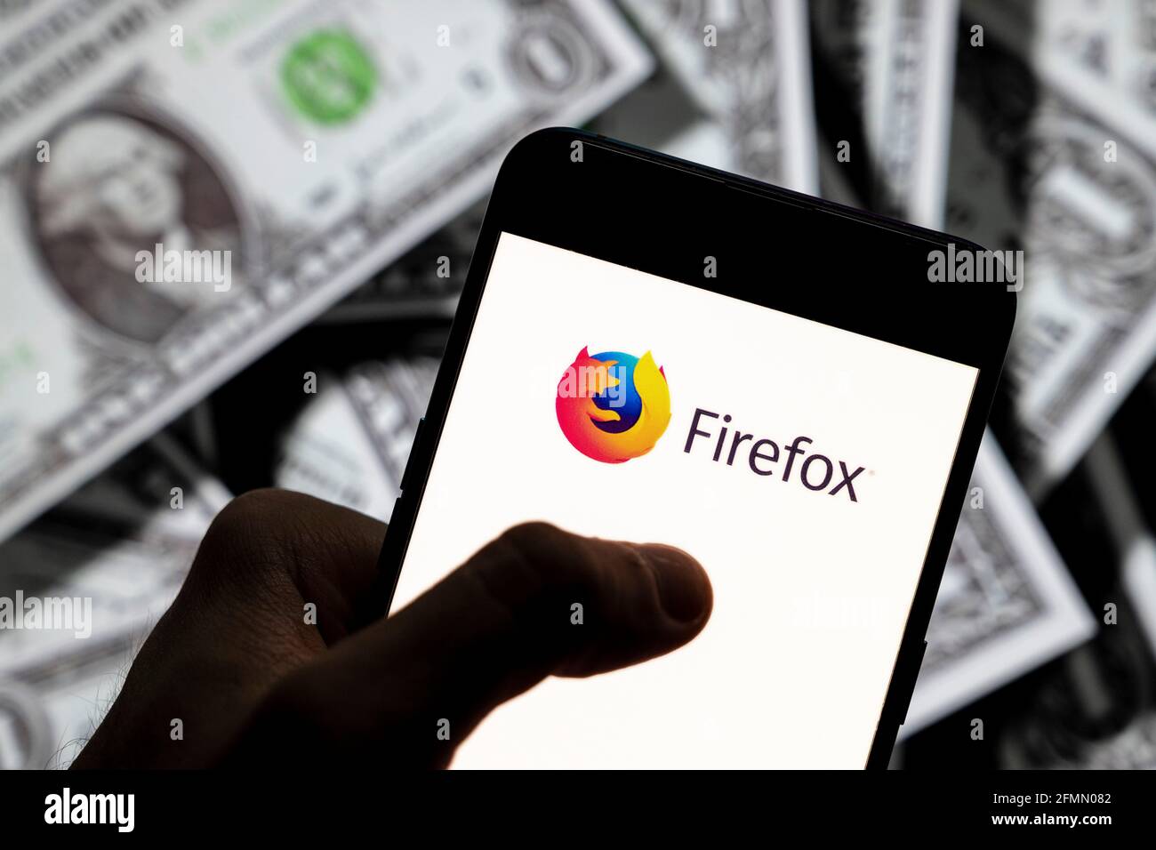In This Photo Illustration The Open Source Web Browser Developed By Mozilla Foundation Firefox Logo Seen Displayed On A Smartphone With Usd United States Dollar Currency In The Background Stock Photo Alamy