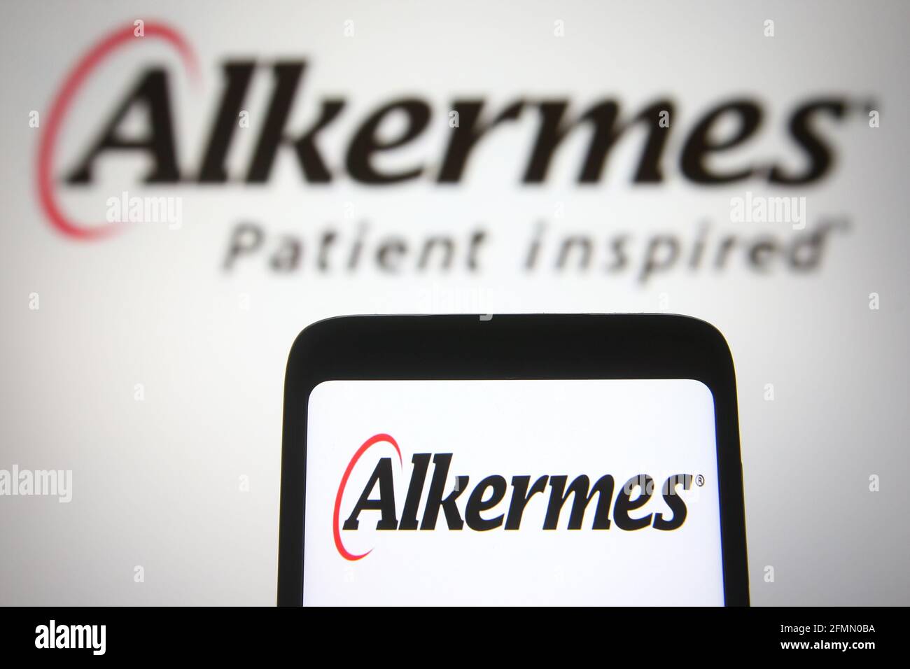 Ukraine. 10th May, 2021. In this photo illustration the Alkermes logo of a biopharmaceutical company is seen on a smartphone and a pc screen. (Photo by Pavlo Gonchar/SOPA Images/Sipa USA) Credit: Sipa USA/Alamy Live News Stock Photo