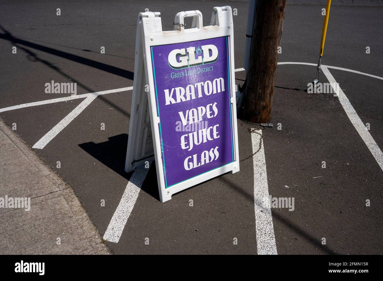 A sign outside a tobacco shop in Tigard advertises the availability of kratom and E-juice vapor on Tuesday, May 4, 2021. FDA has raised serious concerns... Stock Photo