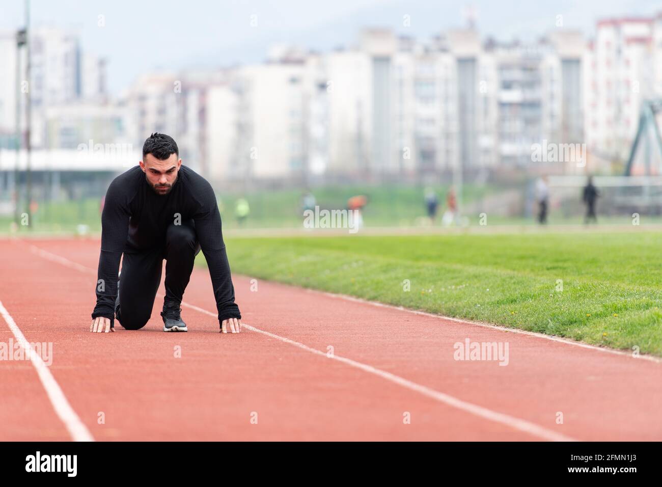 Sprinter Man Running on Red Tracks Lanes in Track and Field Stadium Stock Photo Alamy