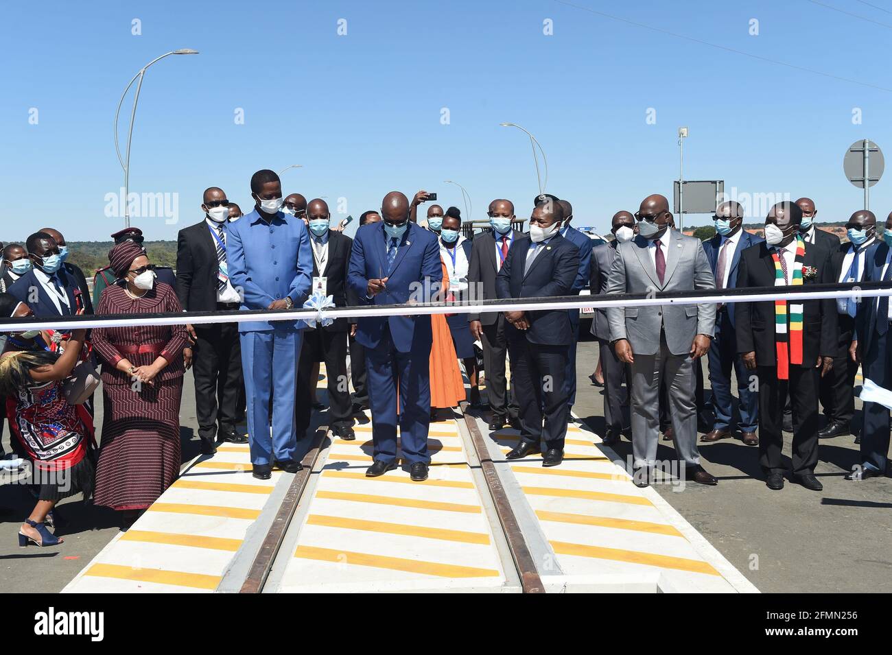 Gaborone. 10th May, 2021. Botswanan President Mokgweetsi Masisi cuts the ribbon to mark the official opening of Kazungula bridge connecting Botswana and Zambia on May 10, 2021. Botswana and Zambia on Monday jointly opened the Kazungula bridge, which is composed of a roadway and a rail track over the Zambezi river that connects the two countries, as well as a one-stop border post. Credit: Tshekiso Tebalo/Xinhua/Alamy Live News Stock Photo