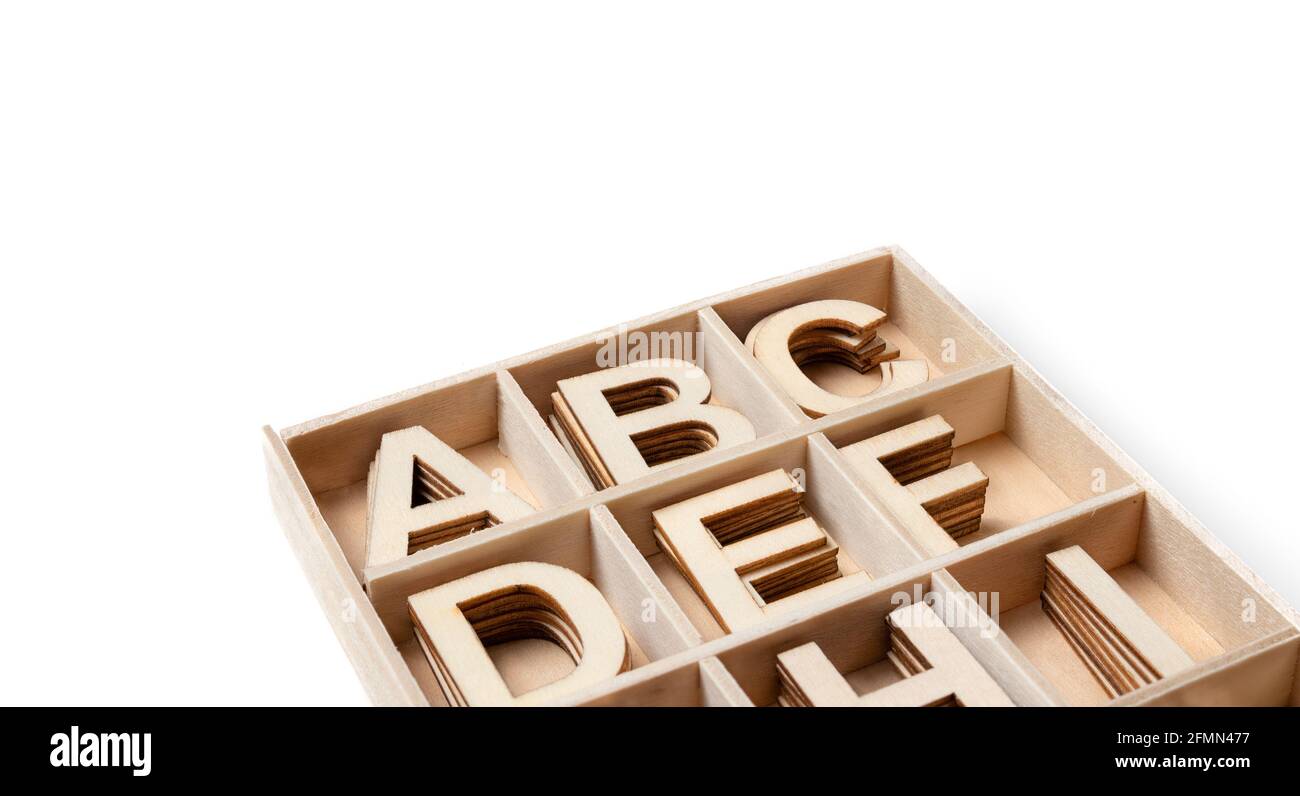 Wooden alphabet letters in storage tray, closeup. Perspective view of ...