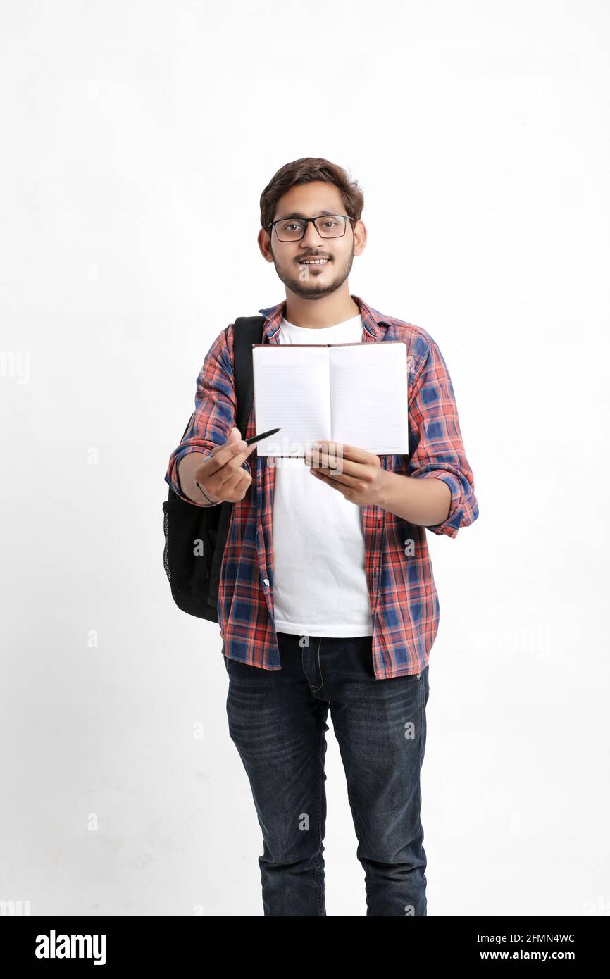 Education concept : Indian college student holding bag and showing note ...