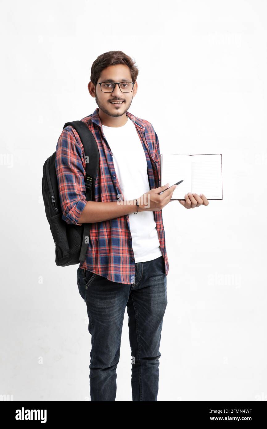 Education concept : Indian college student holding bag and showing note ...