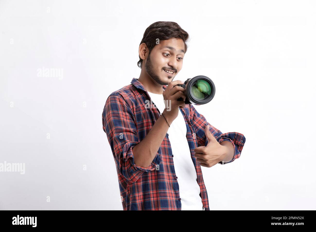 Photographer With Camera on white background. Stock Photo