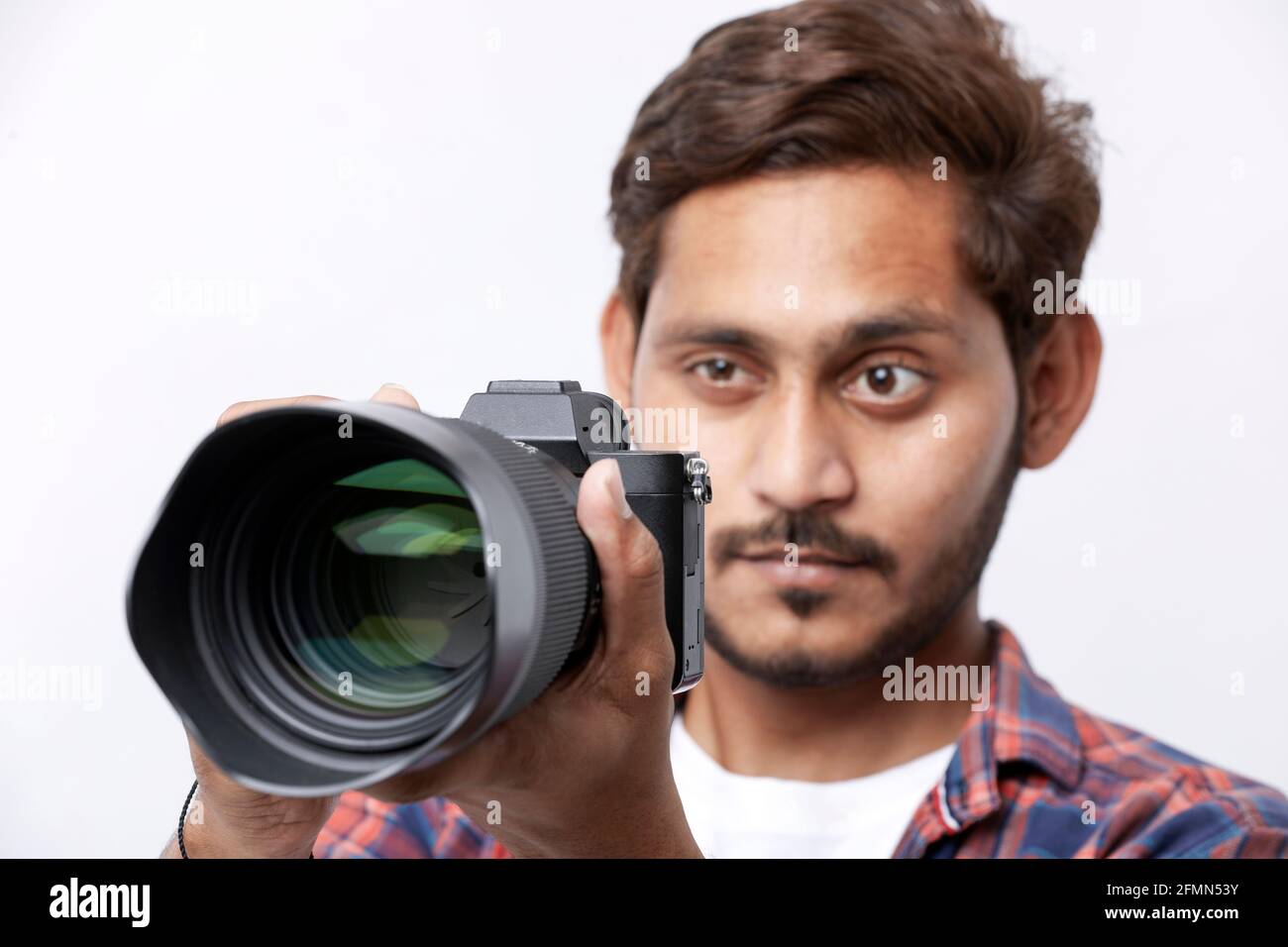 Photographer With Camera on white background. Stock Photo