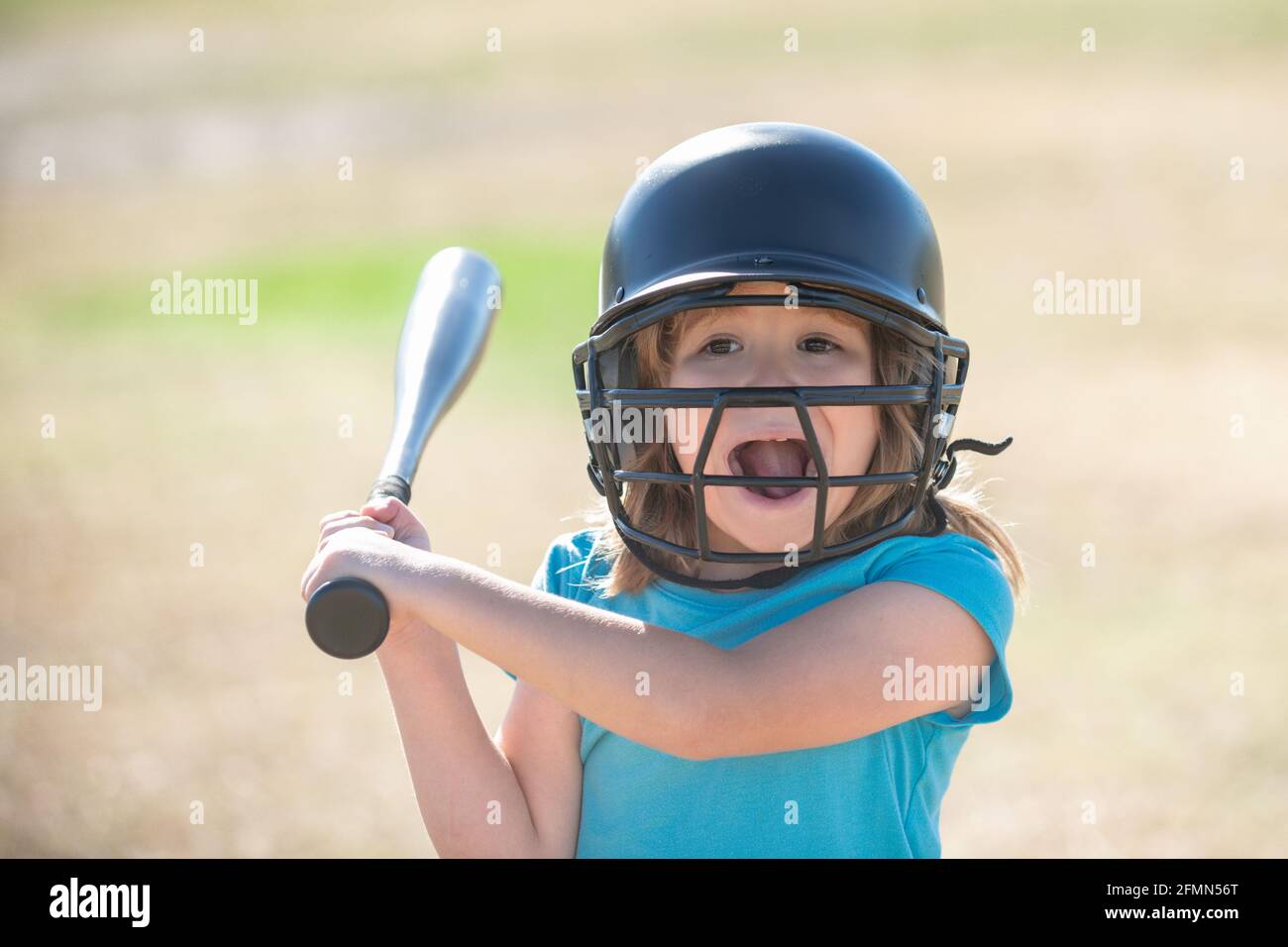 Funny kid up to bat at a baseball game. Close up portrait Stock Photo -  Alamy