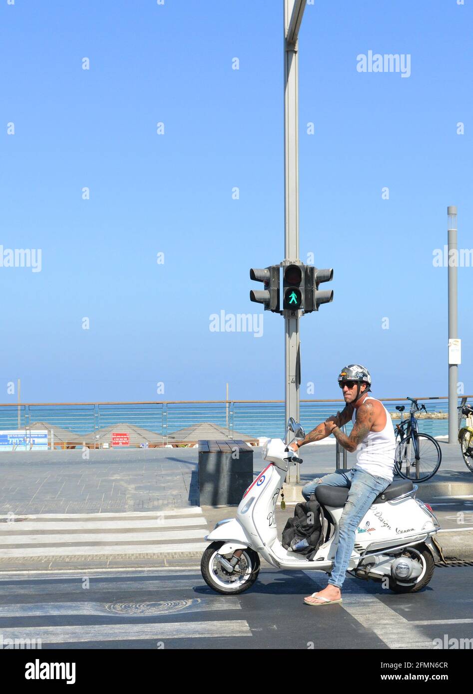 Man on scooter hi-res stock photography and images - Alamy