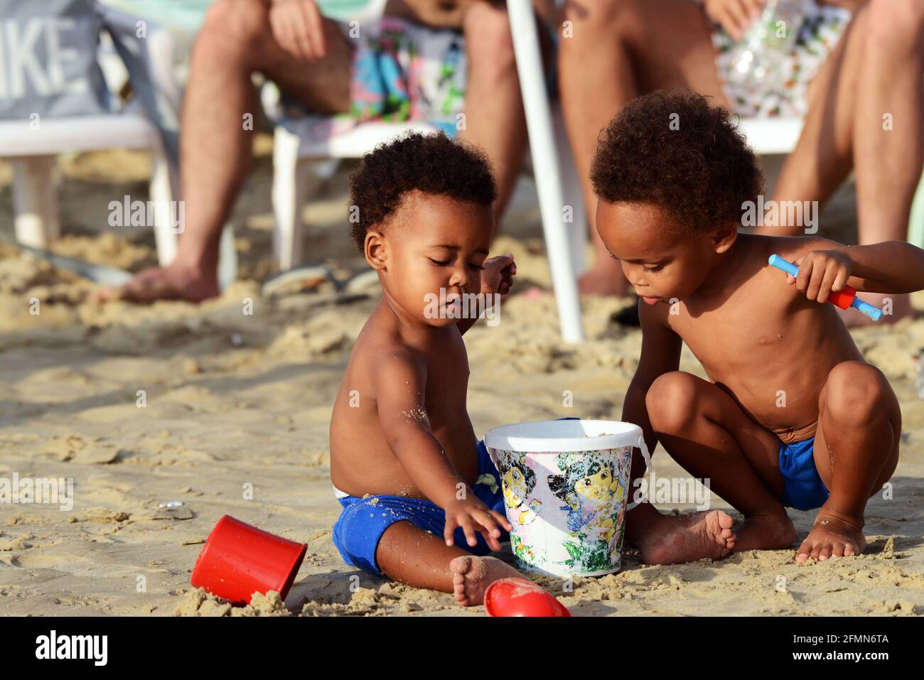 Cute toddlers on the beautiful beach in Tel-Aviv. Stock Photo