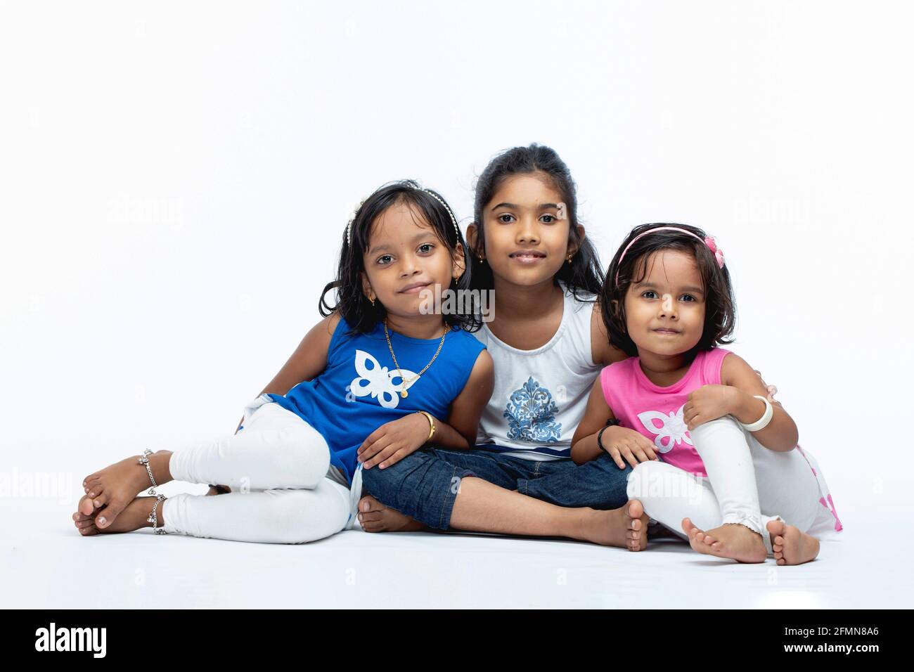 Indian Kids,portrait of three Indian girl kids ,isolated on white background. Stock Photo