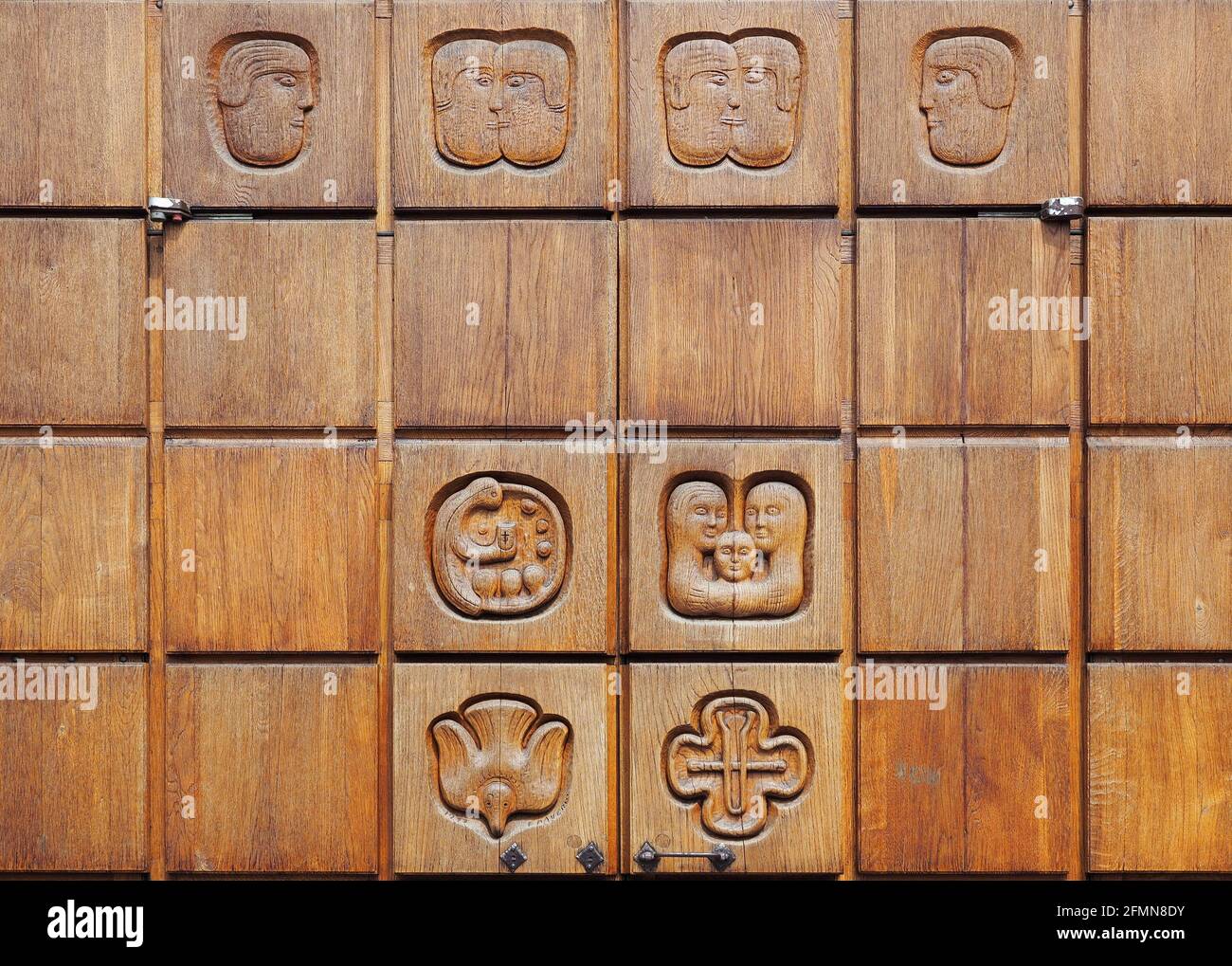 wood carvings on the church door of Redona Bergamo Stock Photo