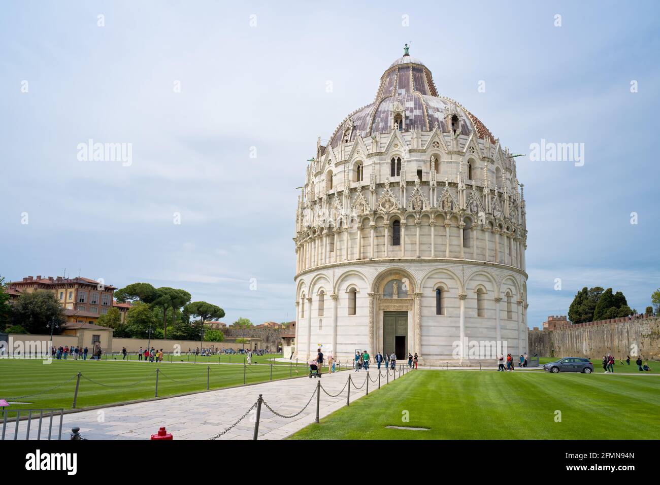 Pisa - May 2021: Square of Miracles (Piazza dei Miracoli) and The Baptistery of Pisa, Tuscany, Italy Stock Photo