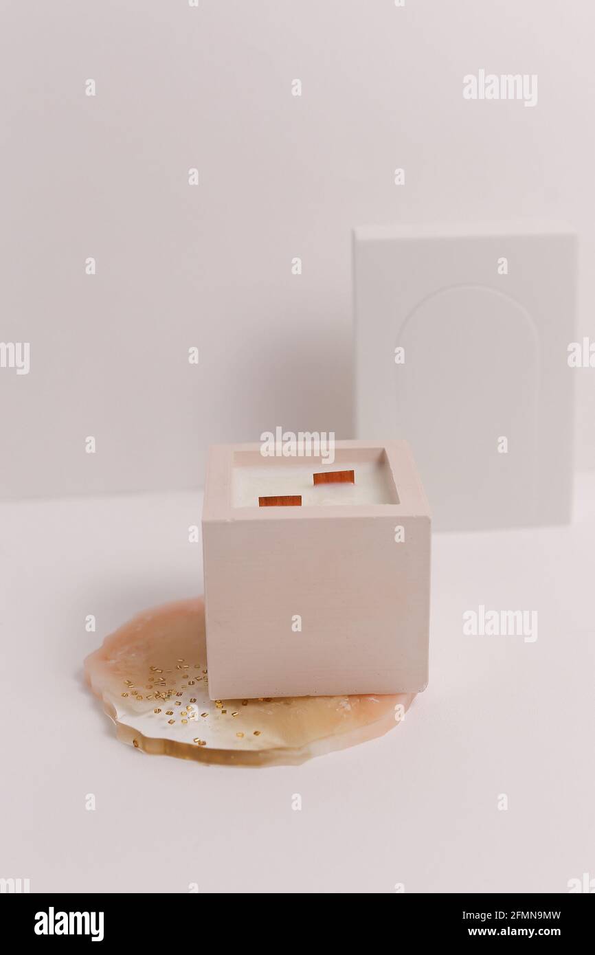 scented candles on off white background in rock holder Stock Photo - Alamy