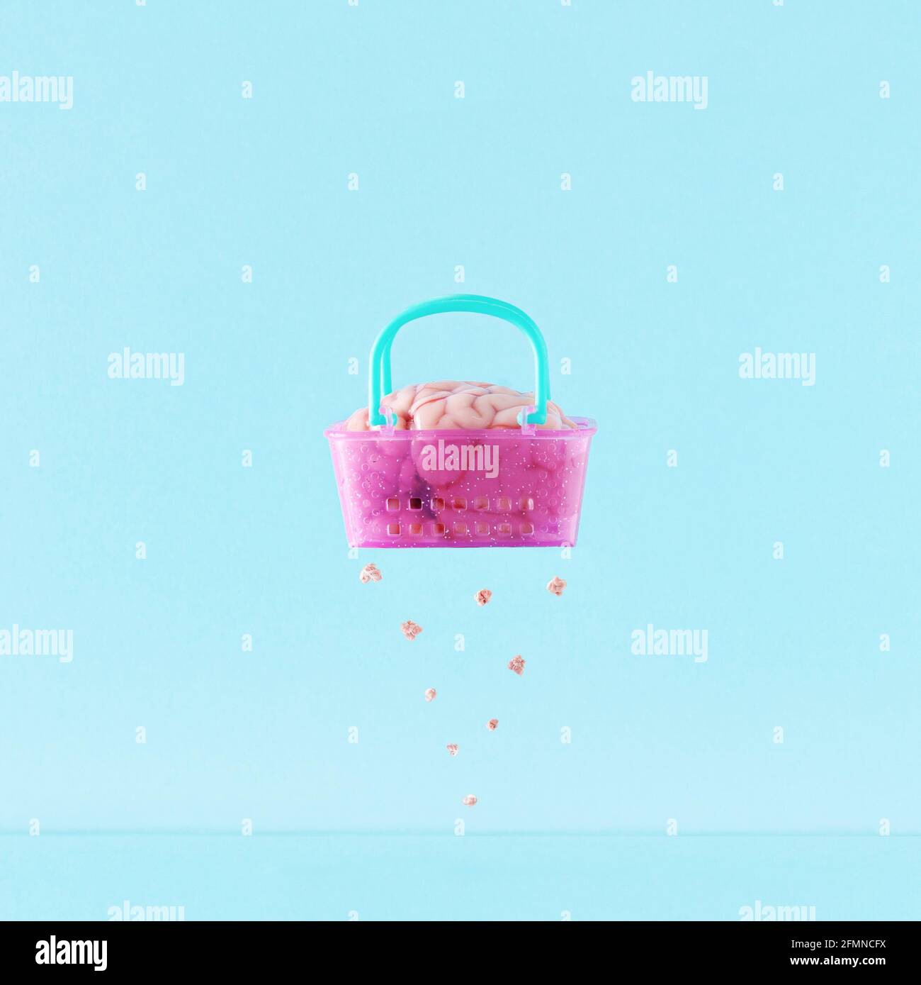 Creative layout with brain in the pink basket  that shows  mental exhaustion and fatigue. Concept of mental health in minimal style. Stock Photo