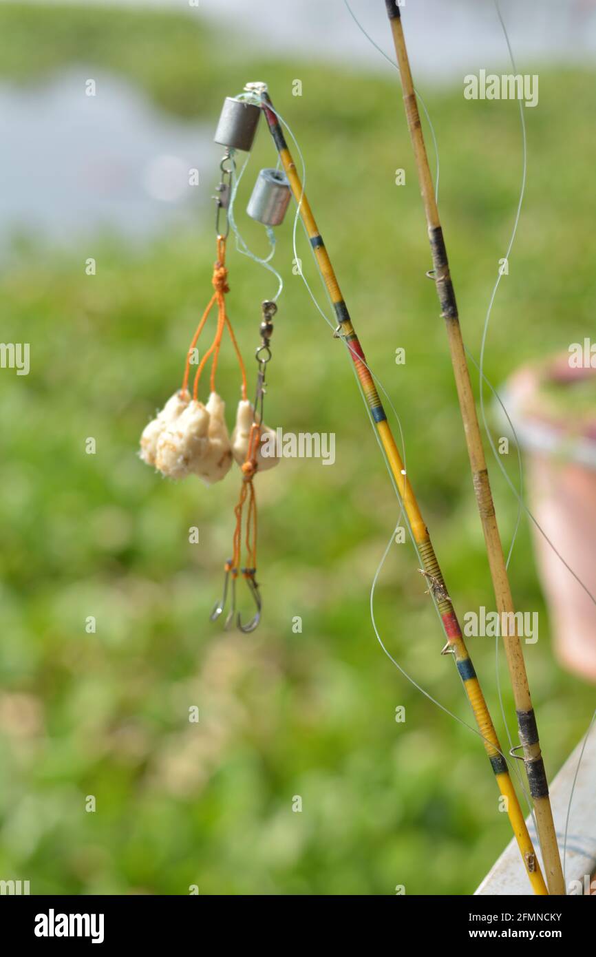 Close up of  some fishing hook and fishing baits with string and rod, selective focusing Stock Photo