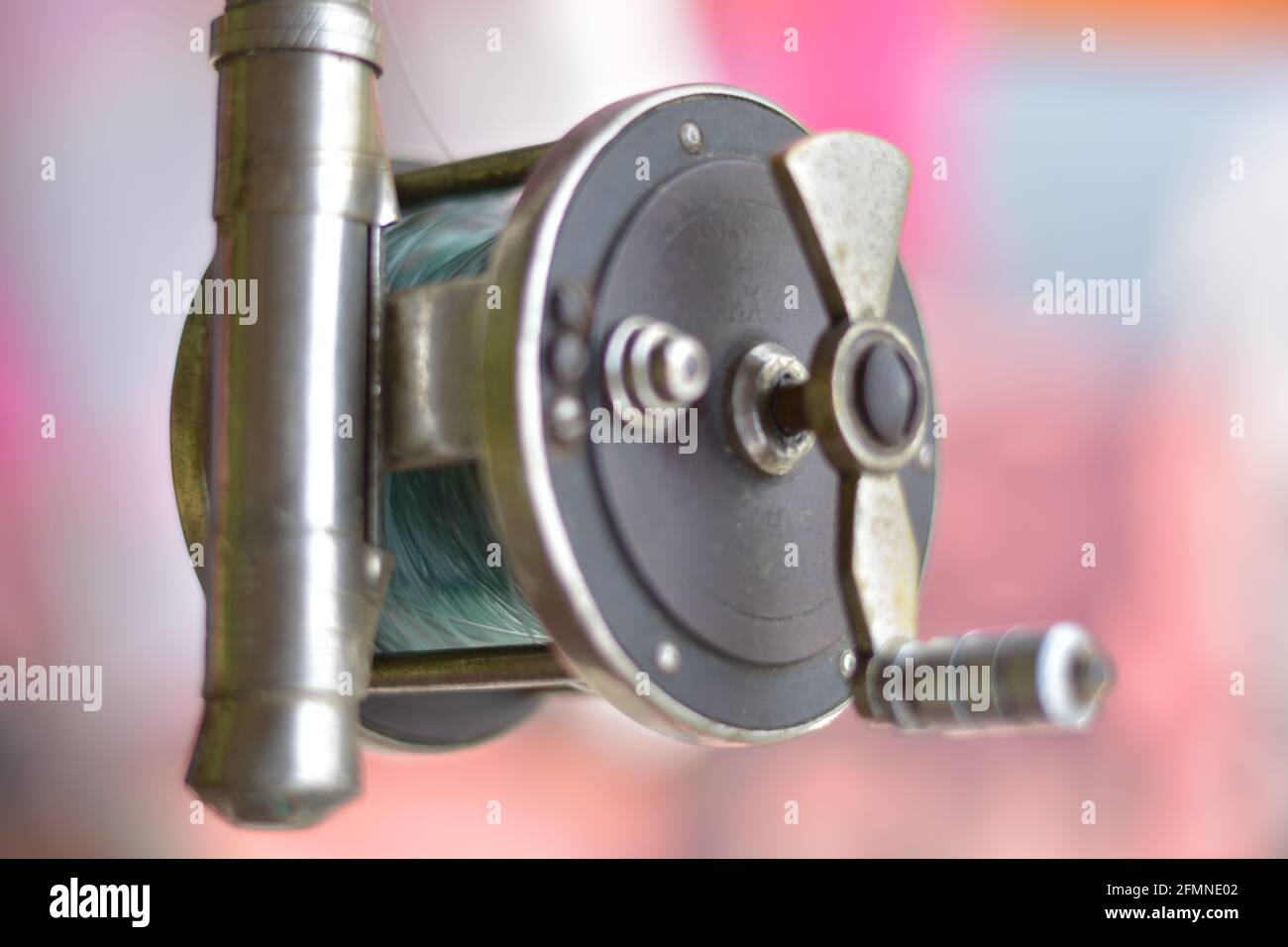 Close up of fishing rod wheel gear, selective focusing Stock Photo - Alamy