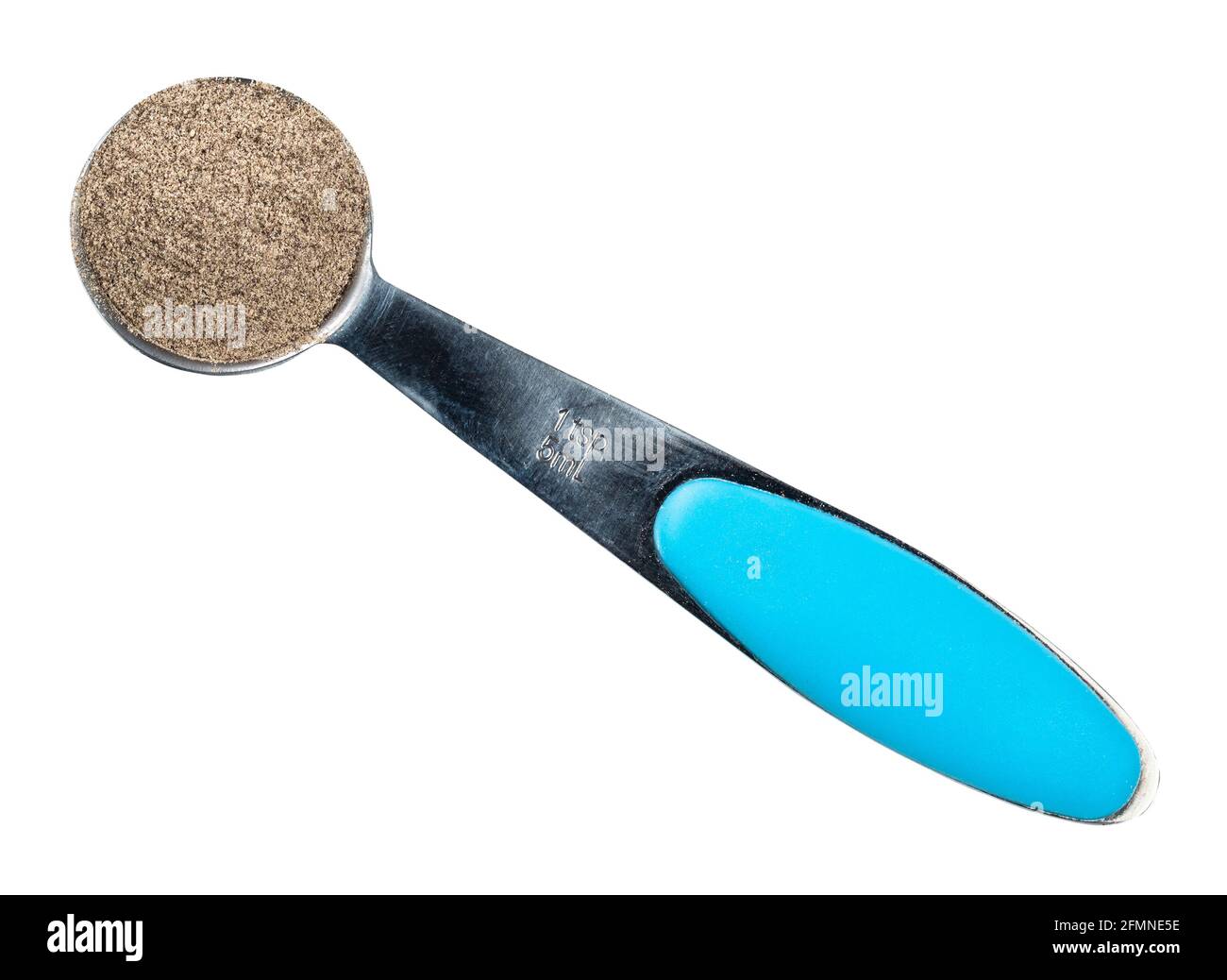 top view of ground black pepper in measuring teaspoon cutout on white