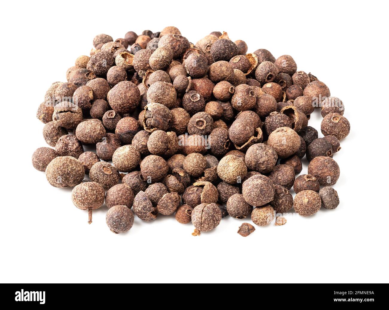 pile of allspice (jamaica pepper) closeup on white background Stock