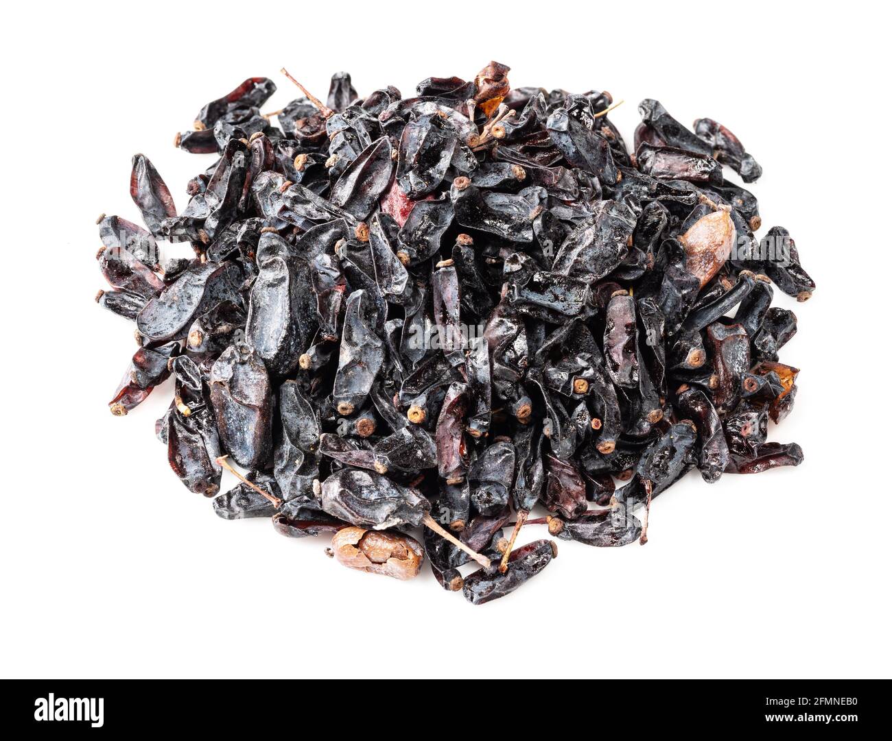 handful of dried black Berberis fruits closeup on white background Stock Photo