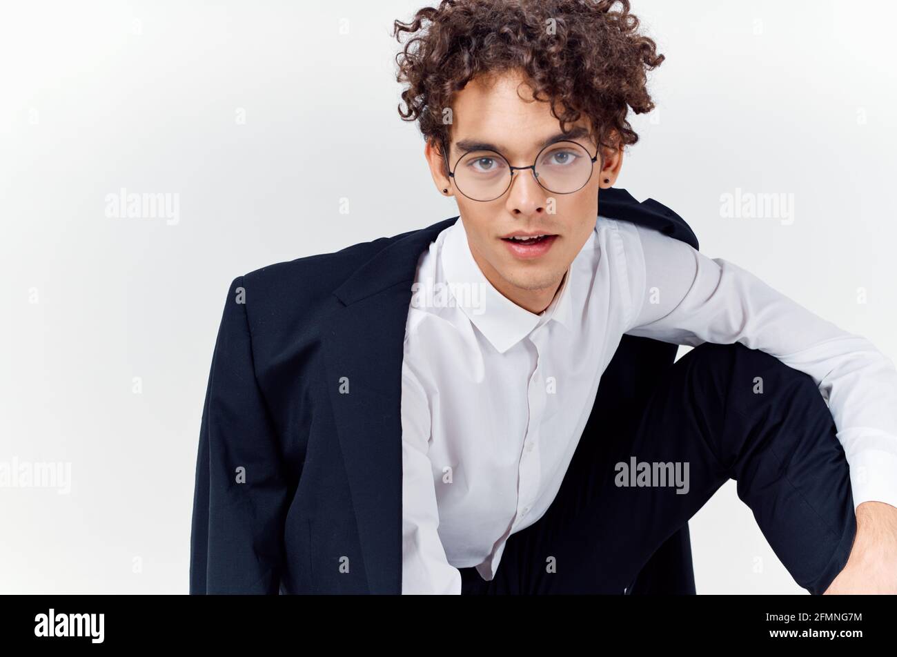 guy curly hair glasses and a jacket photography studio model light ...