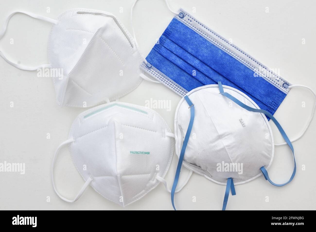 a selection of different protective face masks ffp2 kn95 surgical on