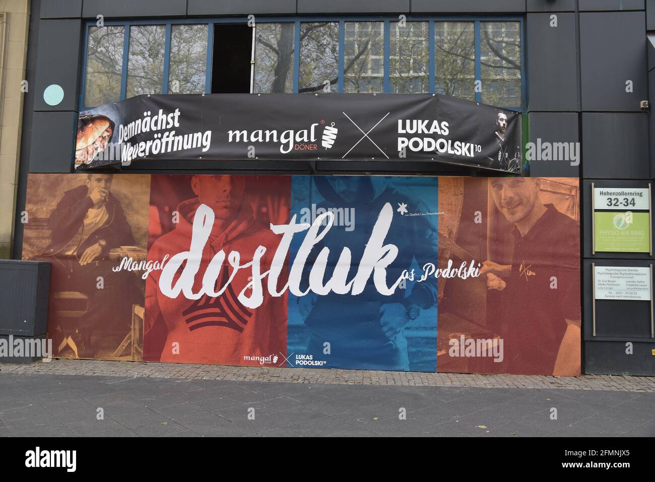 Cologne, Germany. 09th May, 2021. Sign on a shop : A new branch of Dostluk Mangal Döner by Lukas Podolski is being built here. Credit: Horst Galuschka/dpa/Alamy Live News Stock Photo