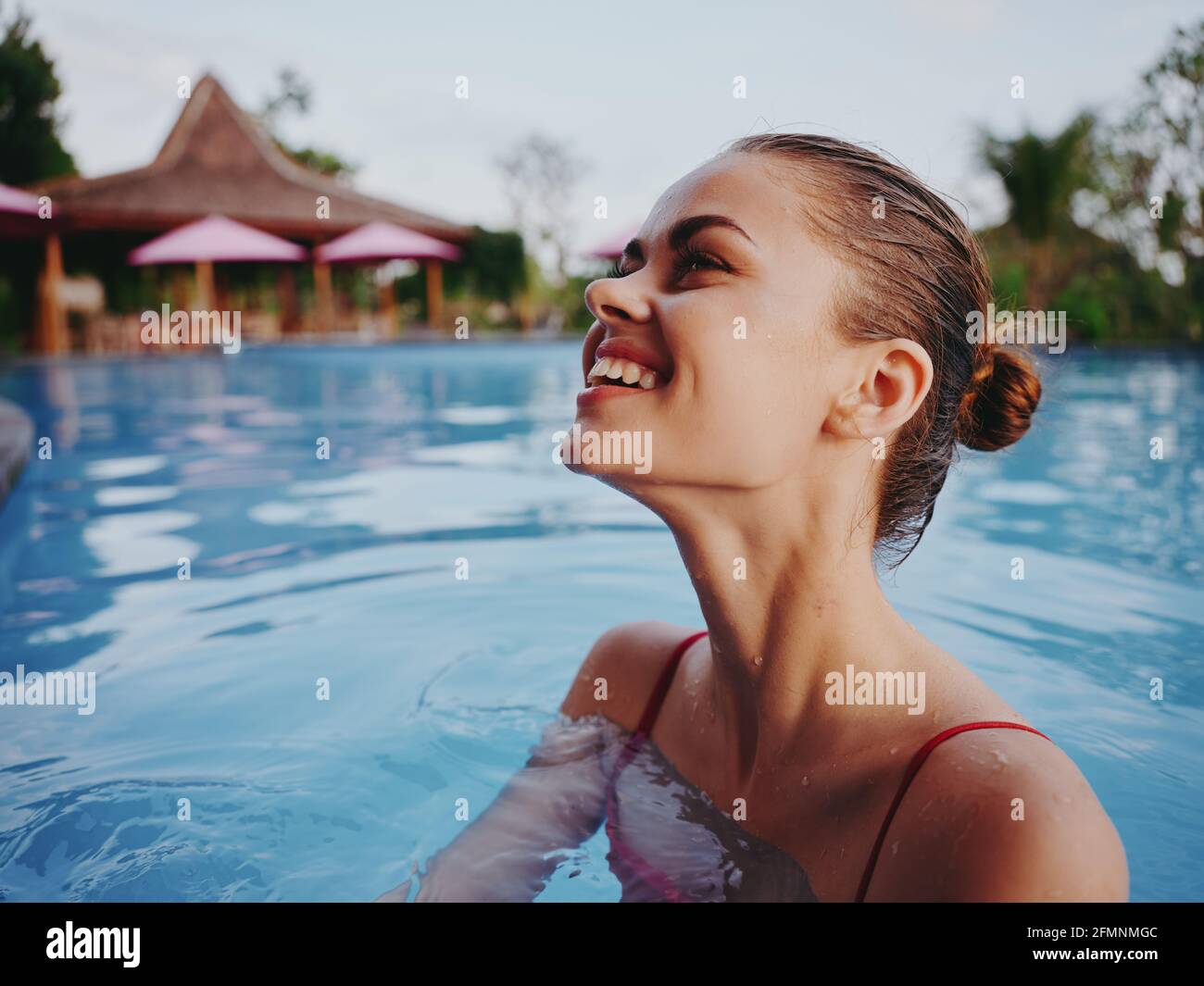 happy woman with wet hair swim in the pool in nature Stock Photo Alamy
