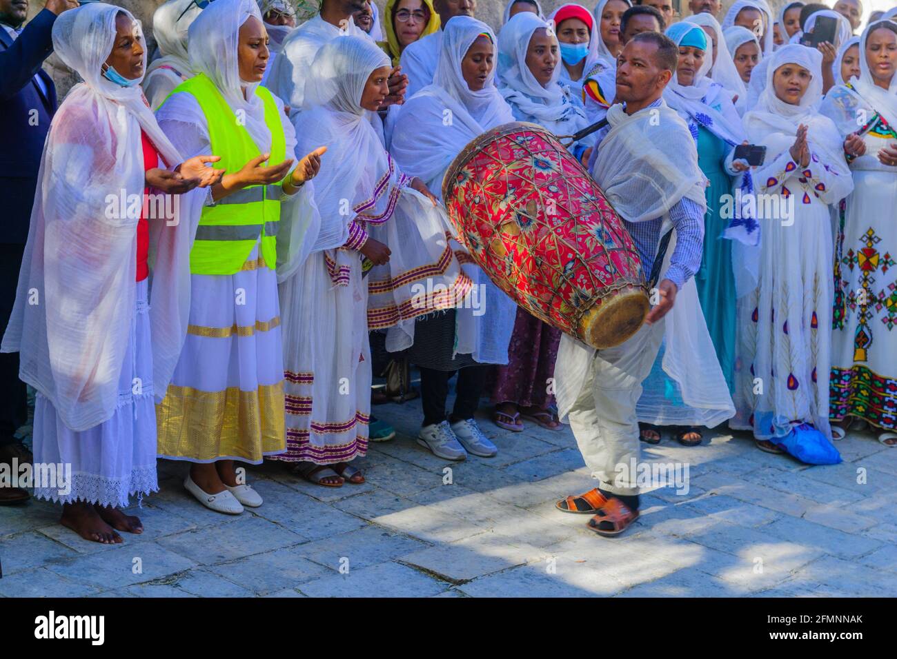 Jerusalem, Israel - May 01, 2021: Paschal Vigil (Easter Holy Saturday) dance of the Ethiopian Orthodox Tewahedo Church community, in the courtyard of Stock Photo