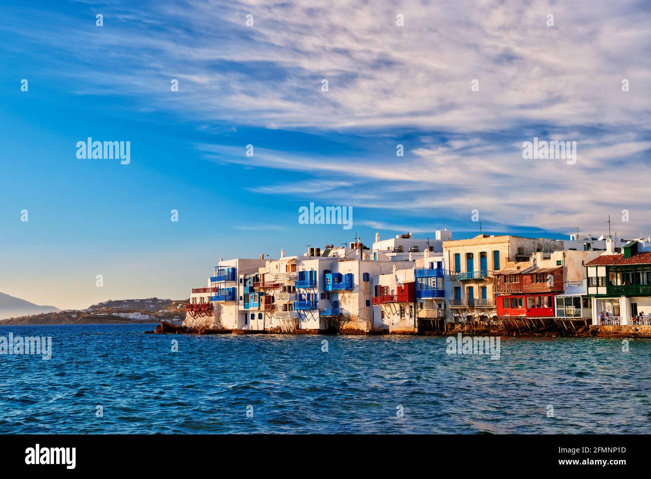 Famous romantic neighbourhood Little Venice of Mykonos main town or Chora, Cyclades, Greece. Whitewashed old fisherman houses at sunset Stock Photo