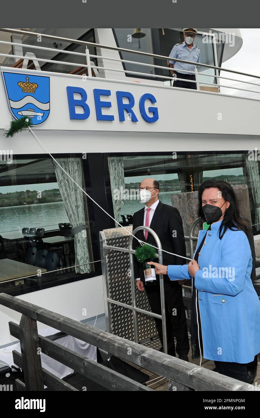 Berg, Germany. 11th May, 2021. Bavarian Finance and Home Affairs Minister Albert Füracker (CSU, l) and godmother Ute Eiling-Hütig (CSU) christen the new electric motor ship 'Berg' on Lake Starnberg. The ship has a capacity of 300 passengers and, at 35 m in length, is the largest fully electric ship on an inland lake in Germany. Credit: Ursula Düren/dpa/Alamy Live News Stock Photo