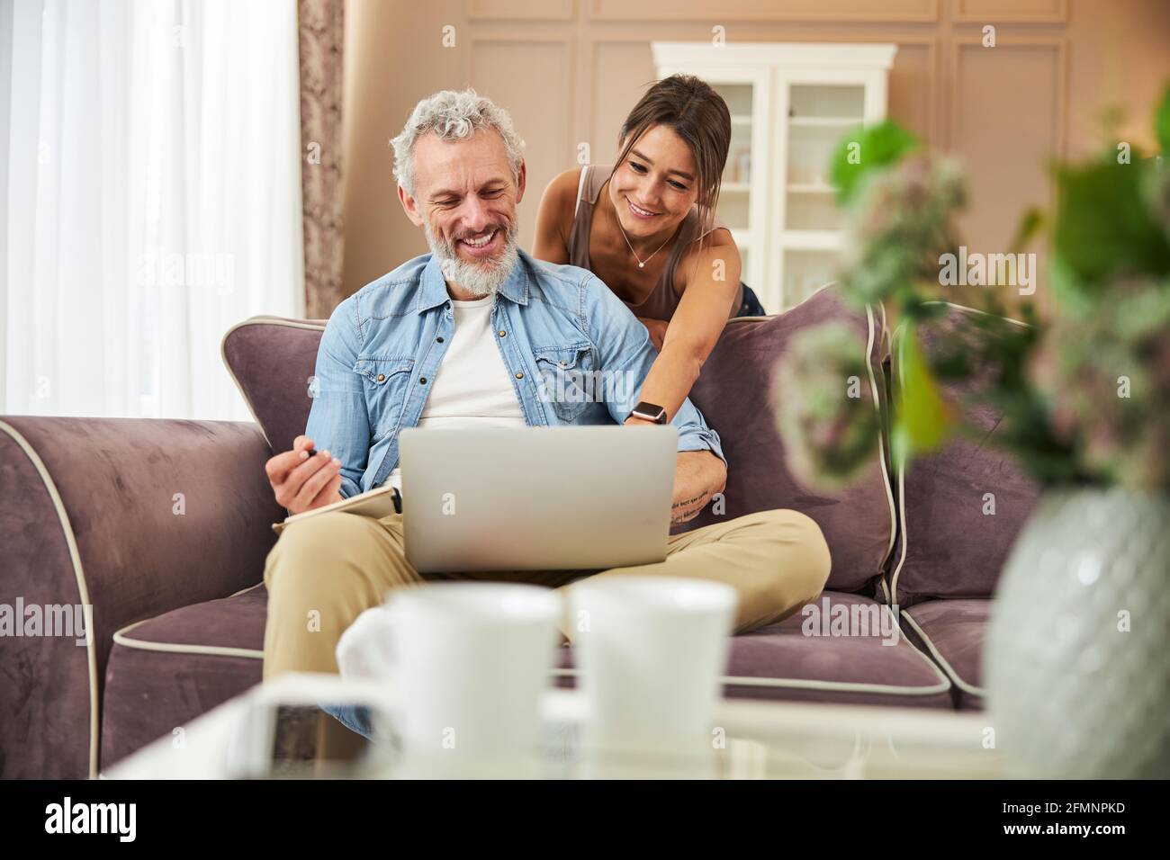 Delighted bearded man using his new gadget Stock Photo