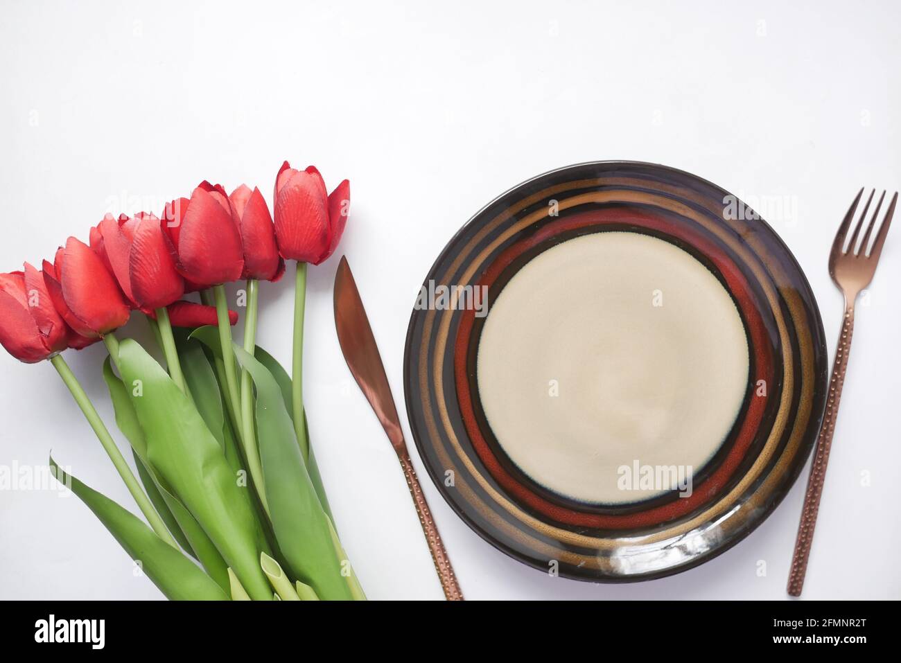 cutlery and empty plate on white background top down Stock Photo