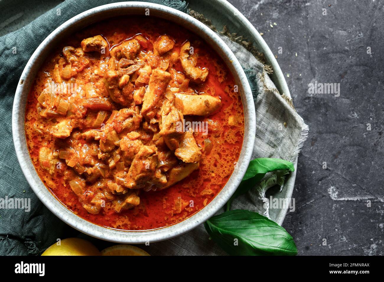 Traditional curry and ingredients. Tikka Masala chicken and rice. Indian food. Top view. Copy