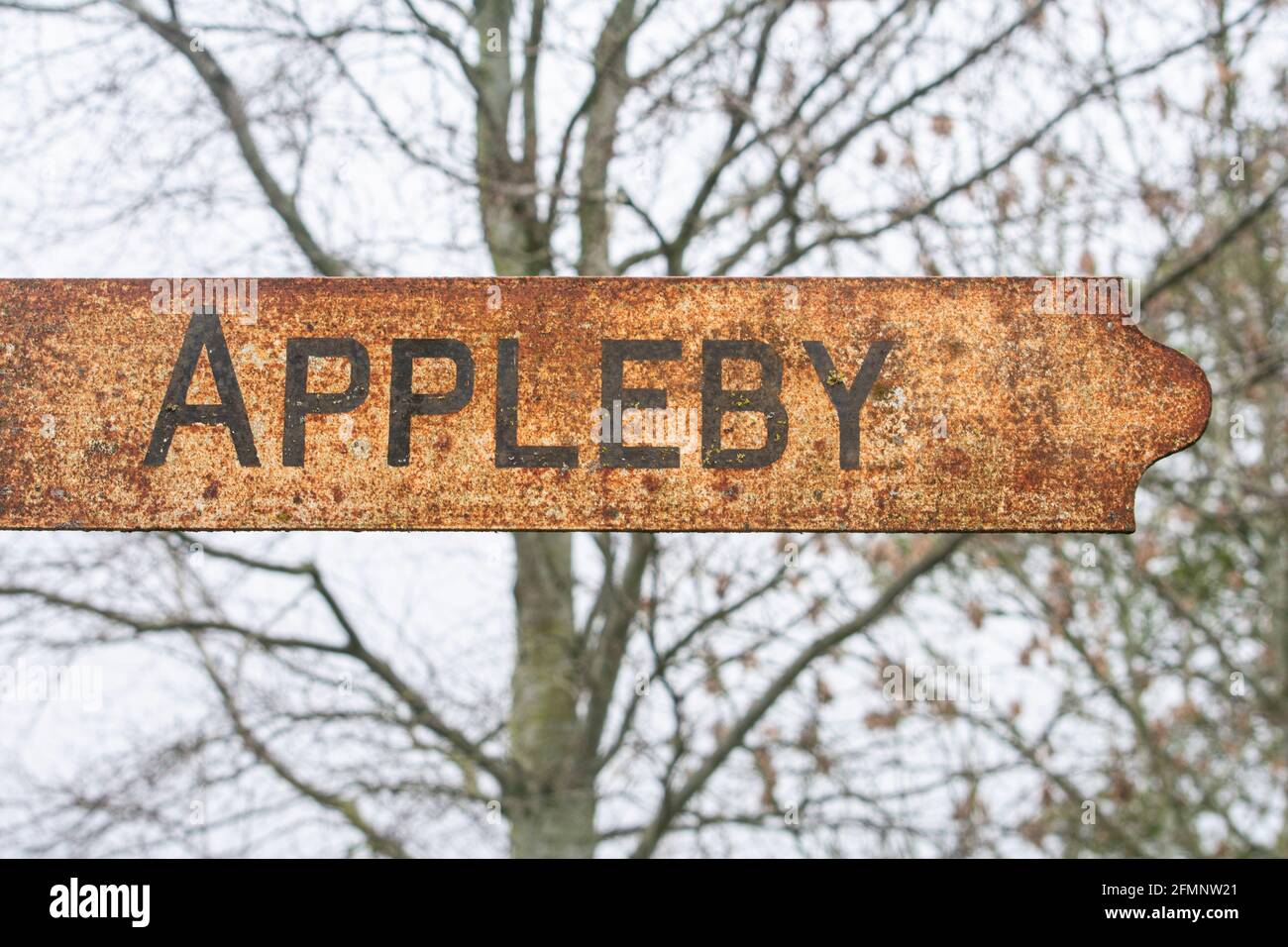 Rusty road sign pointing towards Appleby-in-Westmorland, Cumbria, UK Stock Photo