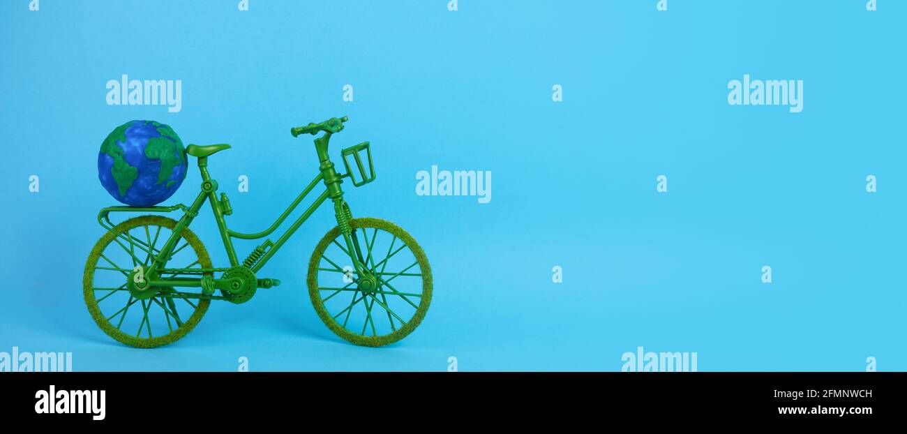 3rd June World Bicycle Day. Green bicycle on blue background. Environment preserve. Stock Photo