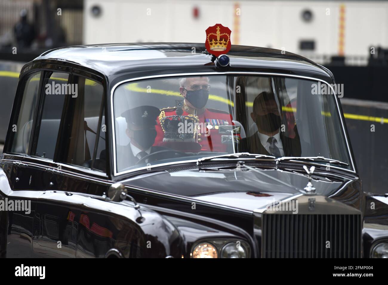 Westminster London, UK. 11th May, 2021. The Imperial State Crown arrives at Westminster where Queen Elizabeth ll will deliver the Queen's Speech in the House of Lords to mark the State opening of Parliament. Credit: MARTIN DALTON/Alamy Live News Stock Photo