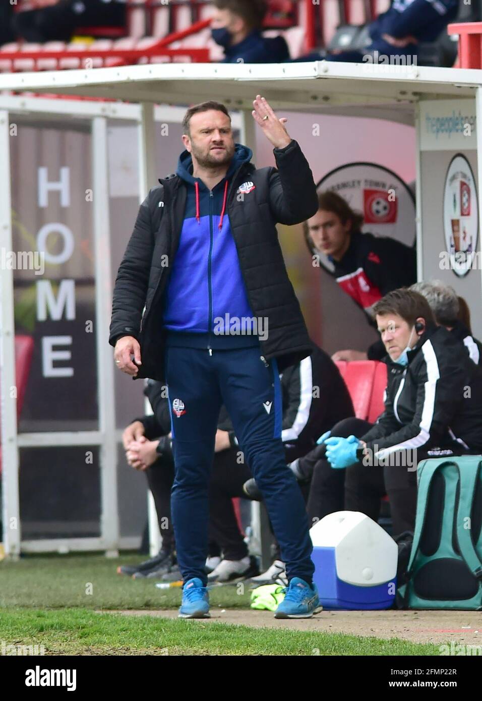 Bolton manager Ian Evatt holds up four fingers during the Sky Bet League Two match between Crawley Town and Bolton Wanderers at the People's Pension Stadium  , Crawley ,  UK - 8th May 2021 -  EDITORIAL USE ONLY No use with unauthorised audio, video, data, fixture lists, club/league logos or “live” services. Online in-match use limited to 120 images, no video emulation. No use in betting, games or single club/league/player publications Stock Photo
