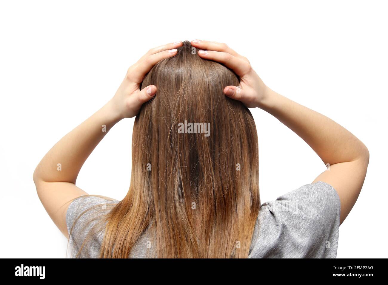 Girl holding her head on a white background Stock Photo Alamy