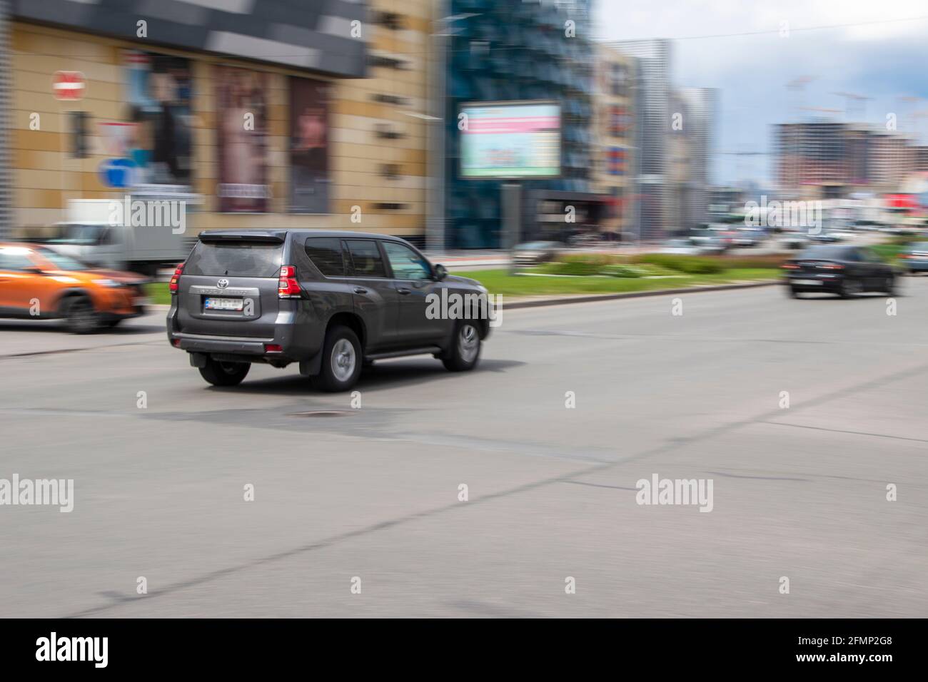 Ukraine, Kyiv - 26 April 2021: Gray Toyota Land Cruiser Prado car moving on the street. Editorial Stock Photo