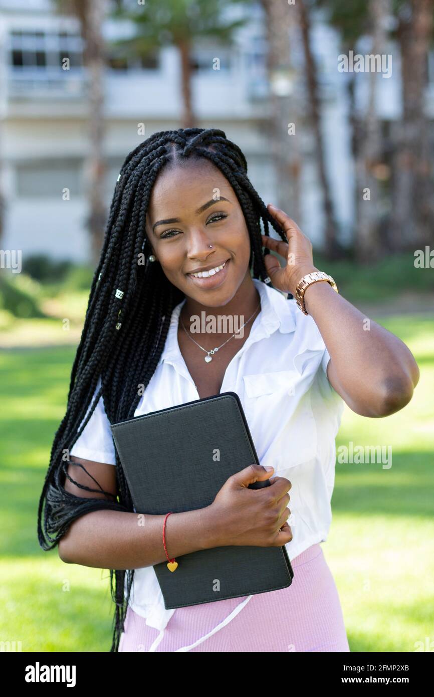 Portrait of beautiful student afro girl looking at camera Stock Photo ...