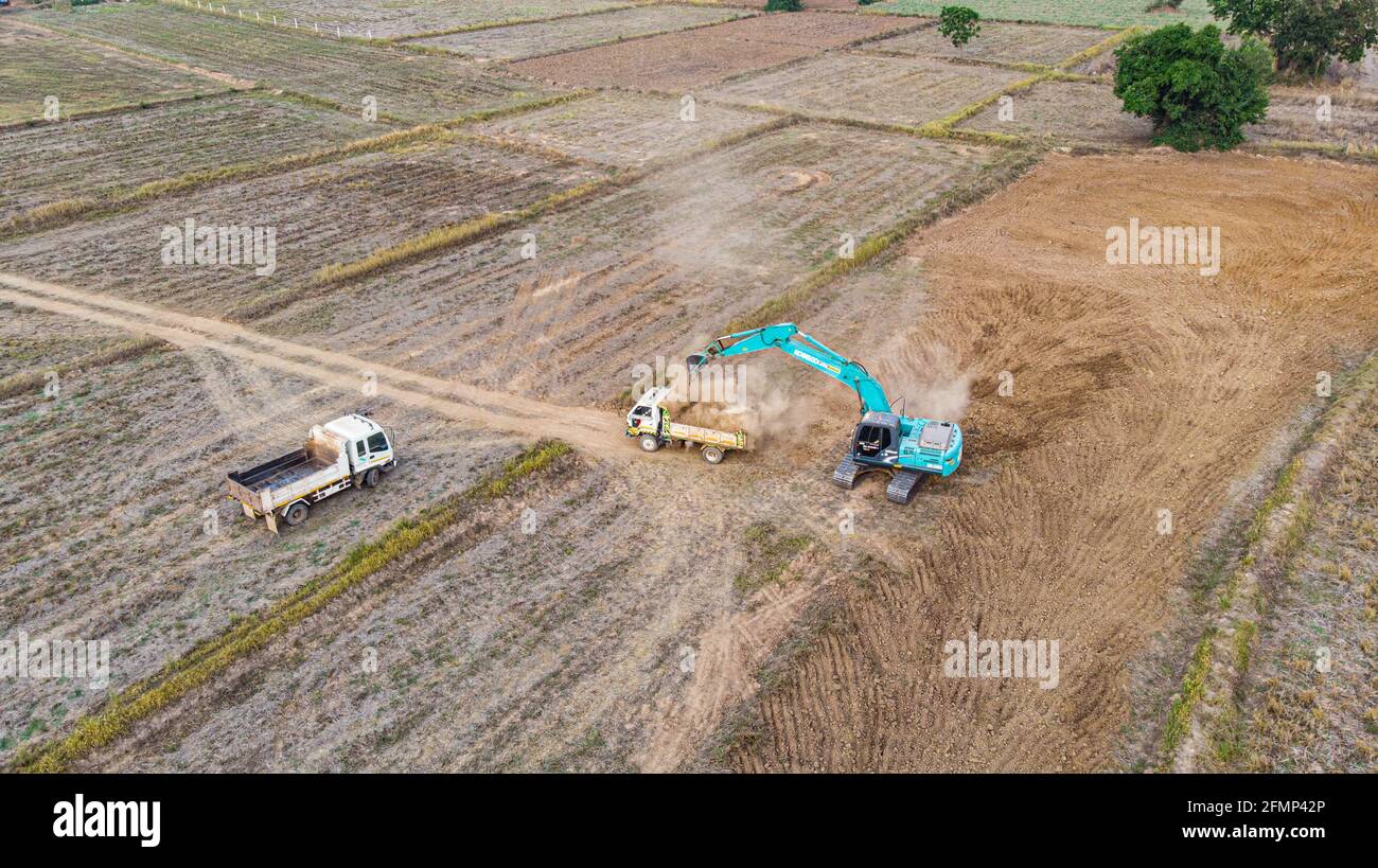 Excavator working on construction site Stock Photo - Alamy