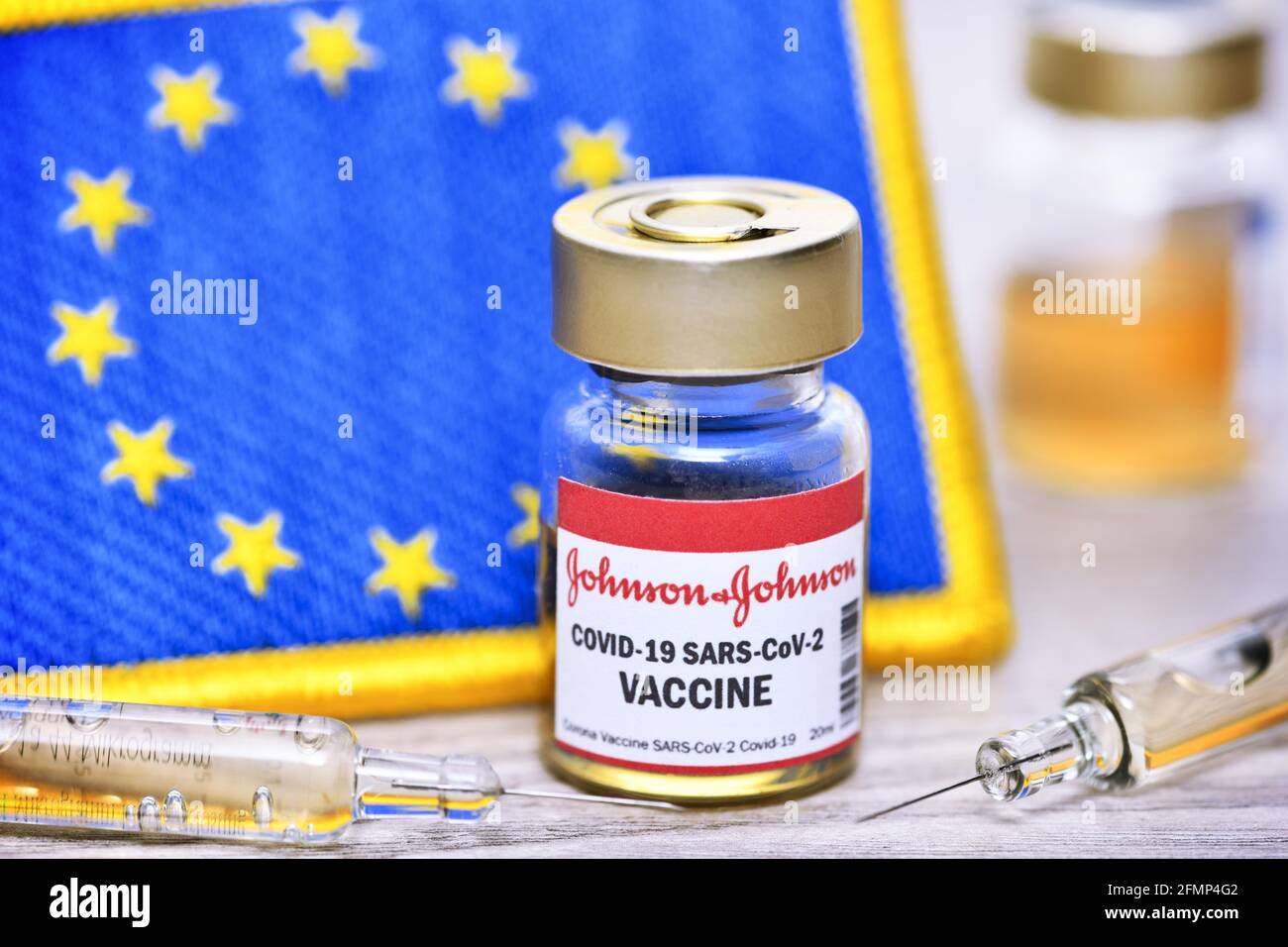 Covid Vaccine Of Johnson And Johnson In Front Of EU Flag, Symbolic Image Stock Photo
