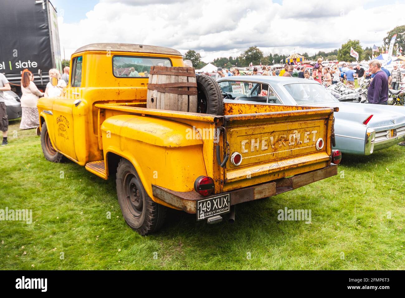 rear view of classic yellow American Chevrolet truck at Stars & Stripes American Classic car show Stock Photo