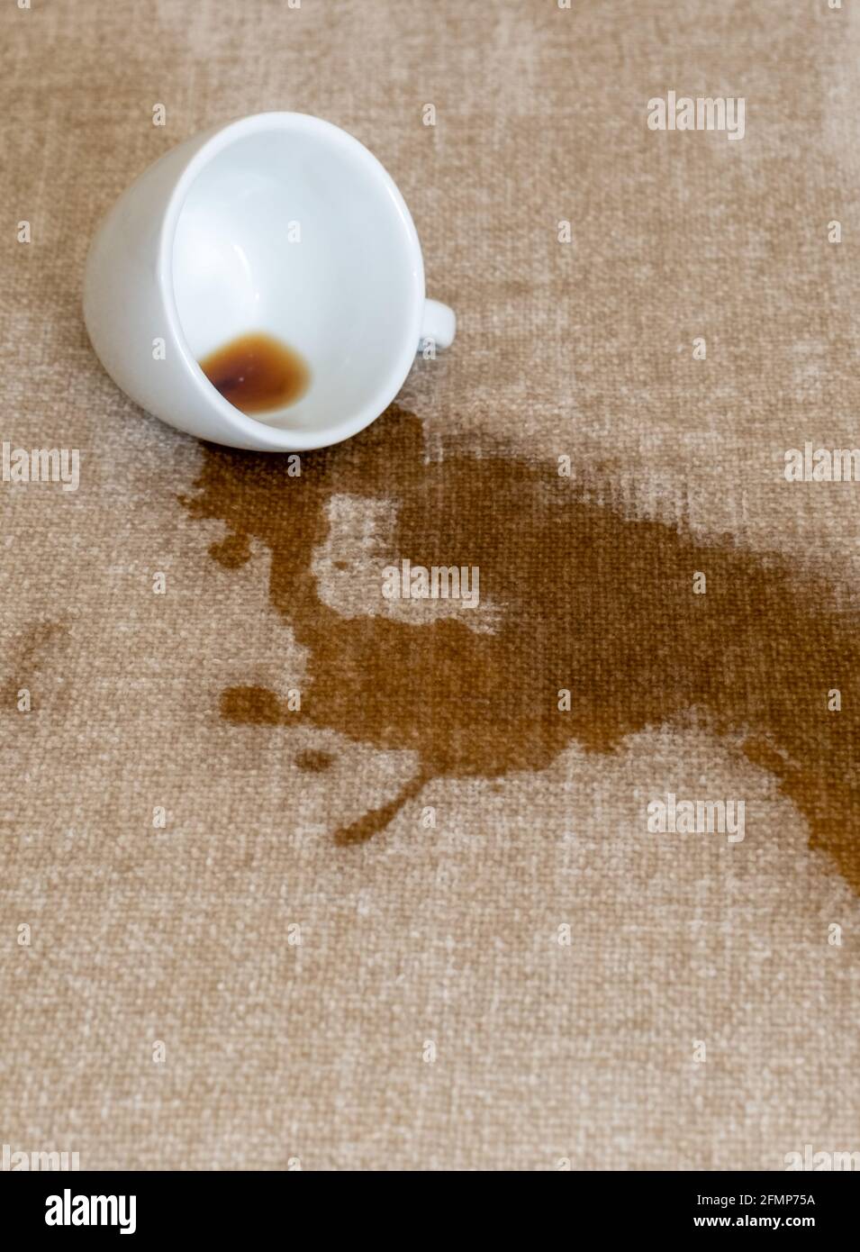 Spilled cup of coffee on the sofa with dirty stain Stock Photo Alamy