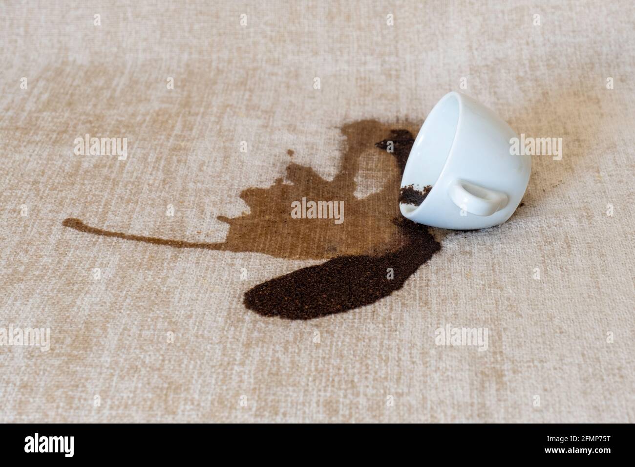 Spilled cup of coffee on the sofa with dirty stain Stock Photo Alamy