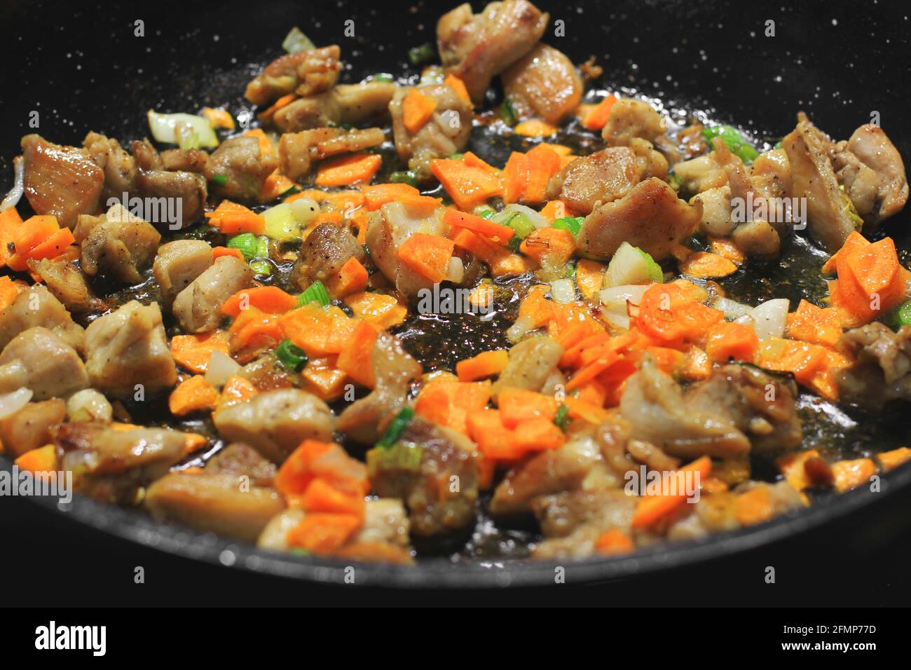 Cooking in a pan. Roasted meat and vegetables Stock Photo Alamy