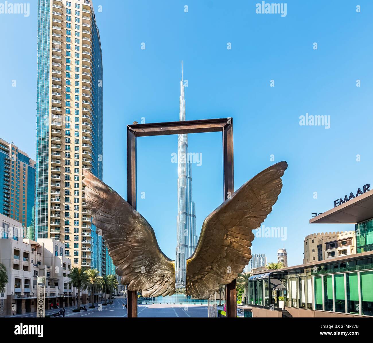 Dubai, UAE - November 30, 2020: The Wings of Mexico modern sculpture by Jorge Marin and Burj Khalifa building is in the background. Stock Photo