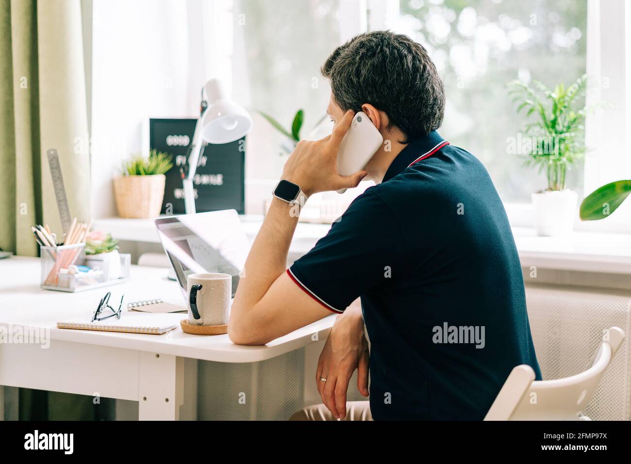 The young man working from home Stock Photo