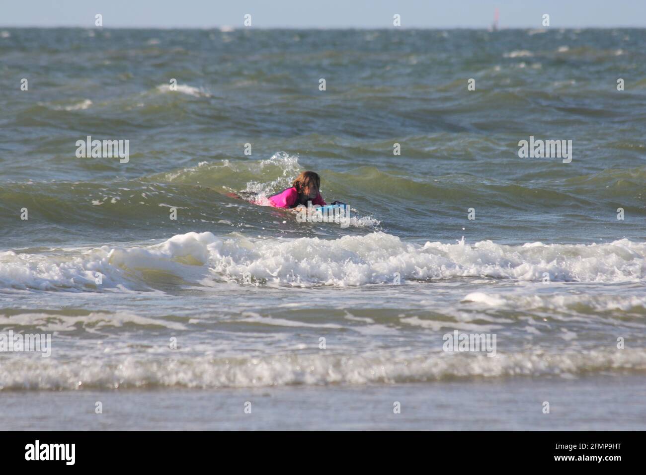 a blonde girl in the swimming in the sea Stock Photo